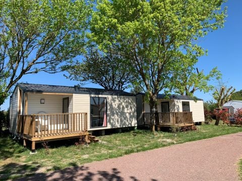 Mobilhome 4 personnes - 2021 - 25m2 Climatisation - Terrasse bois couverte 8m2.