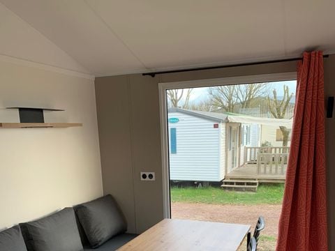 Mobilhome 4 personnes - 2021 - 25m2 Climatisation - Terrasse bois couverte 8m2.