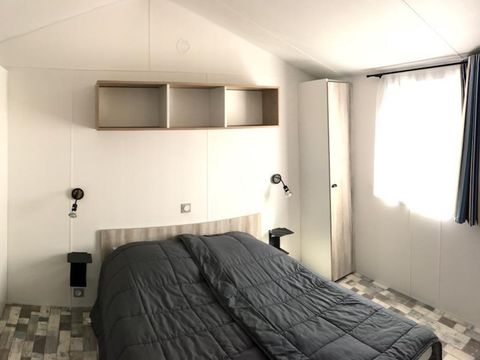 MOBILHOME 4 personnes - PMR 31m² - 2 chambres - terrasse couverte (adapté pour personnes à mobilité réduite) - TV