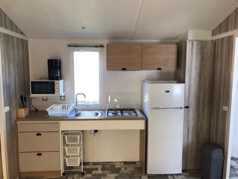 MOBILHOME 4 personnes - PMR 31m² - 2 chambres - terrasse couverte (adapté pour personnes à mobilité réduite) - TV