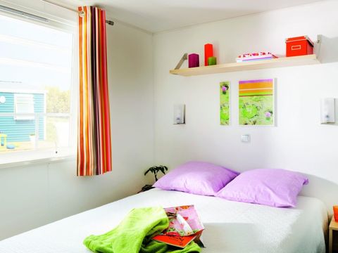 Mobilhome 4 personnes - Confort 26m² - 2 chambres - Terrasse semi couverte - Coté plage