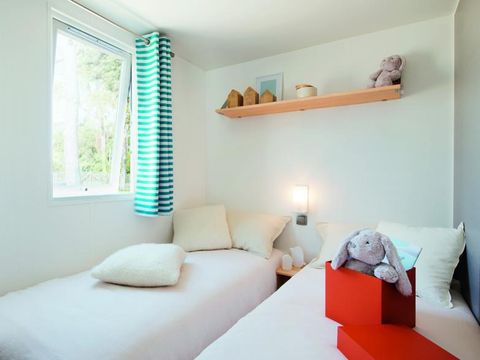 Mobilhome 4 personnes - LITCHI -26 m²- 2 chambres- terrasse semi-couverte de 12m²