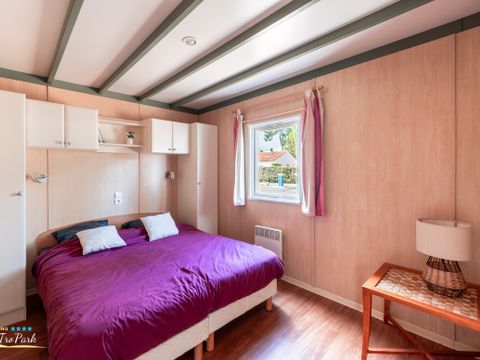 Chalet 4 personnes - Premium 35m² - 2 chambres - Climatisation - Lave-vaisselle - Terrasse couverte 12m²