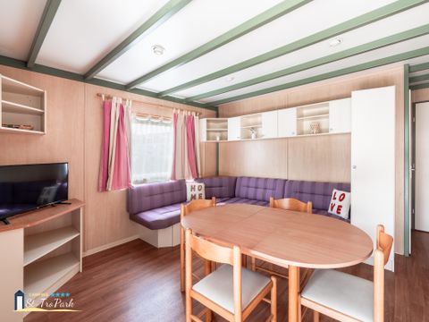 Chalet 4 personnes - Premium 35m² - 2 chambres - Climatisation - Lave-vaisselle - Terrasse couverte 12m²