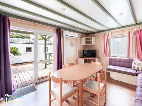 Chalet 4 personnes - Premium 35m² - 2 chambres - Climatisation - Lave-vaisselle - Terrasse couverte 12m²