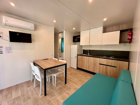 Mobilhome 2 personnes - Premium avec 2 chambres - 2 salles de bain - 2 personnes incluses - 2 personnes supplémentaires possibles moyennant supplément - Veuillez contacter le camping