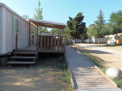 MOBILHOME 4 personnes - Mobilhome HELIOS climatisé PMR (Personne à Mobilité Réduite) 32m² + terrasse semi couverte 15m²