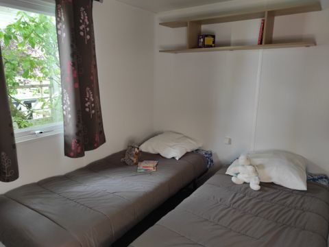 MOBILHOME 4 personnes - LOCATION MOBILHOME TI 26m² avec terrasse semi-couverte (2 chambres) 4 pers. CONFORT 4 pers