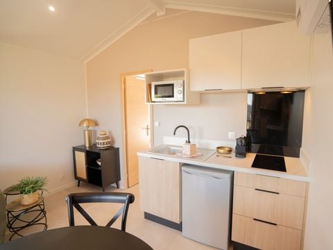 Lodge 4 personnes - Ethnique - Sans spa - 1 chambre - Canapé convertible séjour