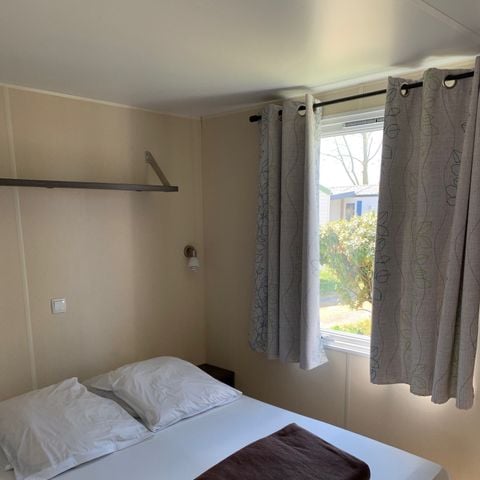 Mobile home 4 persons - 20m² + 8m² covered wooden terrace. 2/4 pers.