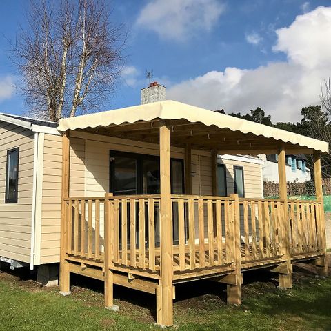 Mobilheim 4 personen - Mobilheim 28 bis 30 m² - 2 Zimmer - halbbedeckte oder überdachte Terrasse - TV -.