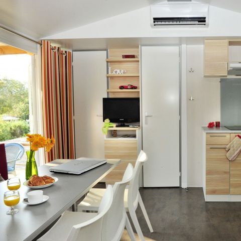 BUNGALOW 4 personnes - Mobil-home | Comfort XL | 2 Ch. | 4 Pers. | Terrasse surélevée | Clim. | TV