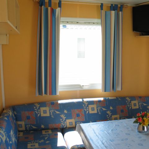 Mobilhome 2 personnes - Standard 17m² (1 chambre) + terrasse intégrée couverte 9m² + TV 2/3 pers