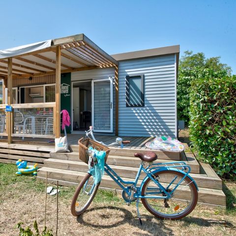 Stacaravan 6 personen -    	 Homeflower premium 35m² (3 kamers) + CLIM + halfoverdekt terras + TV + Bedlinnenpakket + handdoeken | 6 personen