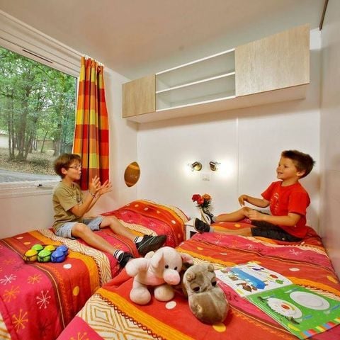 Mobilhome 8 personnes - Premium Exclusive | 3 Ch. | 6/8 Pers. | Terrasse surélevée | 2 SDB | Clim. | TV