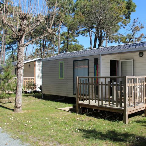 Mobilheim 4 Personen - MALAGA 27m² - 2 Zimmer mit halbüberdachter Holzterrasse.