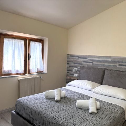 APPARTEMENT 2 personen - 1-slaapkamerappartement (2 personen inbegrepen - 2 extra personen mogelijk met toeslag, neem contact op met de camping)