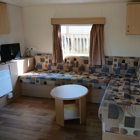 Stacaravan 7 personen - Stacaravan standaard 34m² (3 sl.k.-6/7 pers) + terras) 7 pers