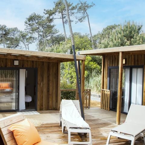 Stacaravan 2 personen - NIEUW//Homeflower Premium 18m² - 1 slaapkamer + Half overdekt terras + LV + TV + Bedlinnenpakket + Airconditioning -