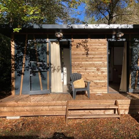 Chalet 1 person - Standard 10m² - Gemeinschaftsdusche und -WC + Überdachte Terrasse