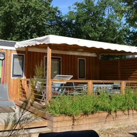 Mobilheim 4 personen - Mobilheim Holz PREMIUM CLIM 28m² - 2 Zimmer + Terrasse + TV + Bettwäsche + Handtücher inklusive | 4 Personen