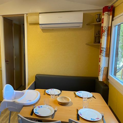 Mobilheim 4 personen - Holz-Mobilheim BABY mit KLIMA - 26m² mit überdachter Terrasse / 2 Zimmer