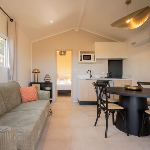 LODGE 4 people - Lodge Ethnique (without spa) 1 bedroom + sofa bed living room